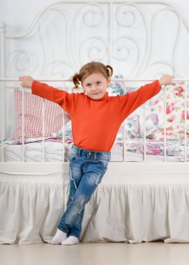 Little girl in the bedroom