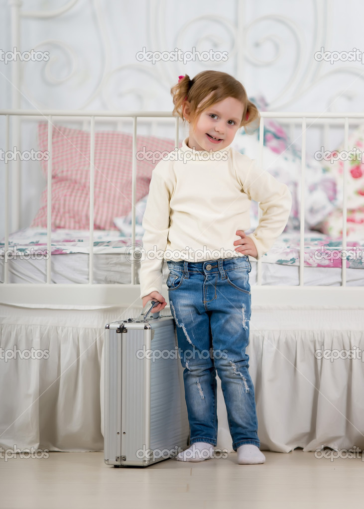 Little girl with suitcase Stock Photo by ©gawriloff 27755105