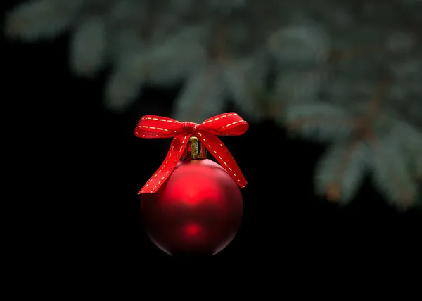 Red christmas ball on black background — Stock Photo, Image