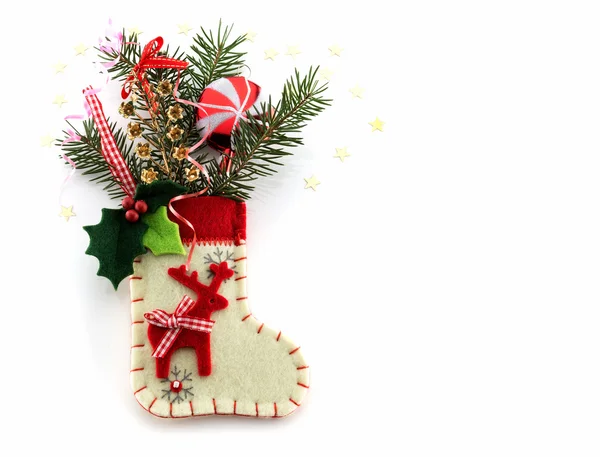 Juldekorationer och strumpa på vit bakgrund — Stockfoto