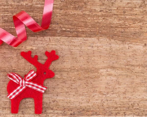 Christmas Reindeer on wooden background — Stock Photo, Image