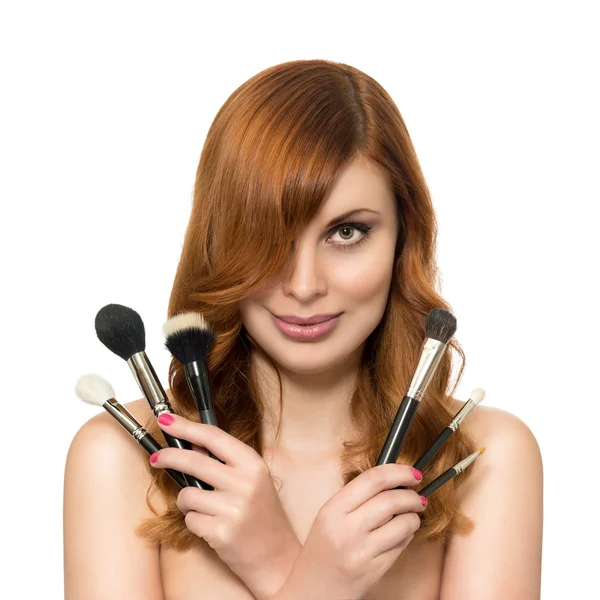 Beautiful woman with perfect skin and beauty hairstyle with brush for makeup on a white background. — Stock Photo, Image