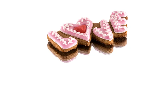 Soubory cookie s textem lásky a červené srdce na den svatého Valentýna — Stock fotografie