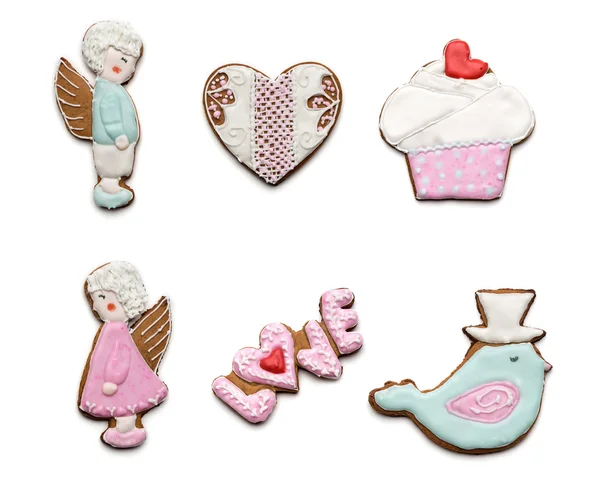 Sada několika různých chutné cookies na bílém pozadí na valentines day. pták, srdce, andělé, koláče a cukroví s textem láska. — Stock fotografie
