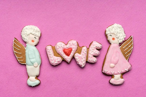 Cookies with the text of love and couple of angels on Valentine's day — Stock Photo, Image