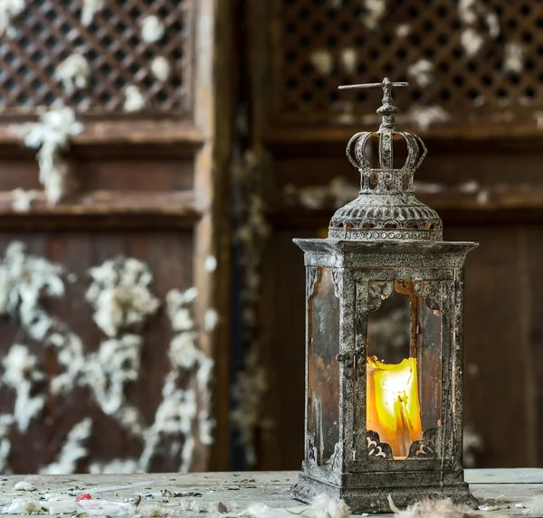 Vintage old lamp for the candle on wooden table — Stock Photo, Image