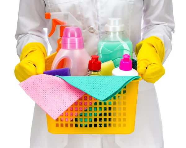 Cleaner maid woman with plastic basket and cleaning supplies on white background — Stock Photo, Image