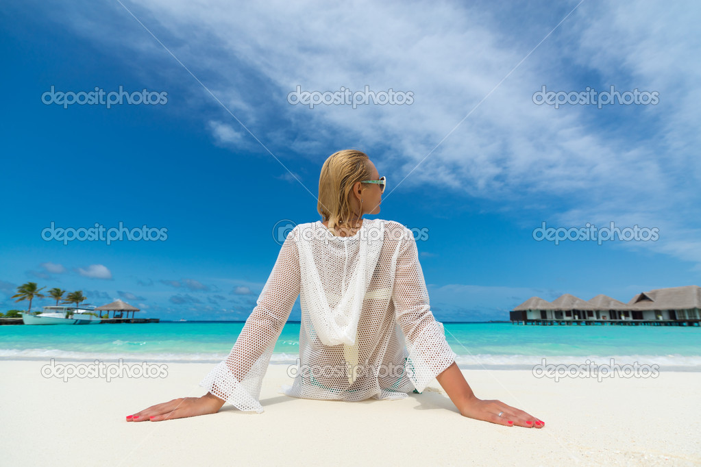 Beach vacation. Hot beautiful woman enjoying looking view of beach