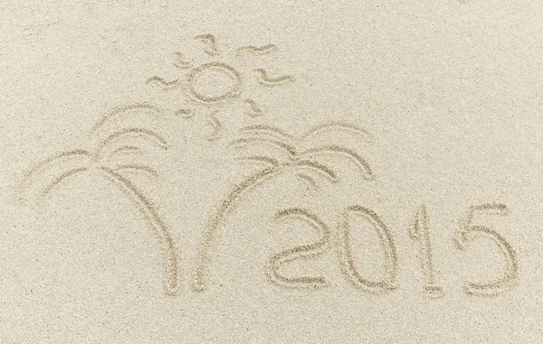 New year 2015 message on the sand beach