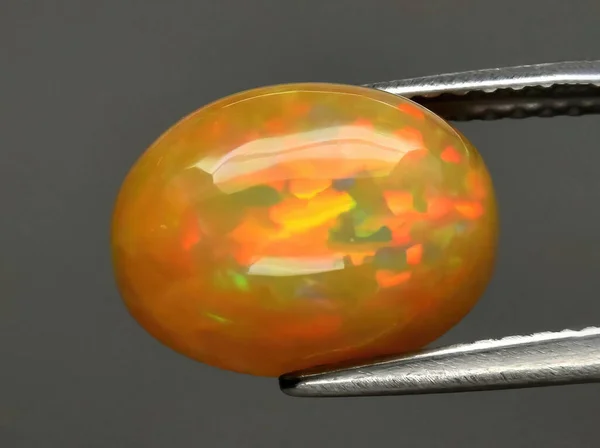 Natural Gemstone Opal Tongs Background — Stock Photo, Image
