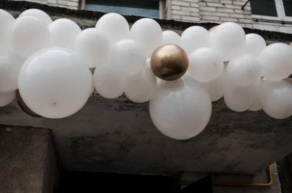 Wedding arch made of white balloons. Childrens holiday celebration