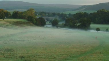 Early morning sunshine illuminates Bolton Abbey in Wharfedale, North Yorkshire, England, takes its name from the ruins of the 12th-century Augustinian monastery now known as Bolton Priory