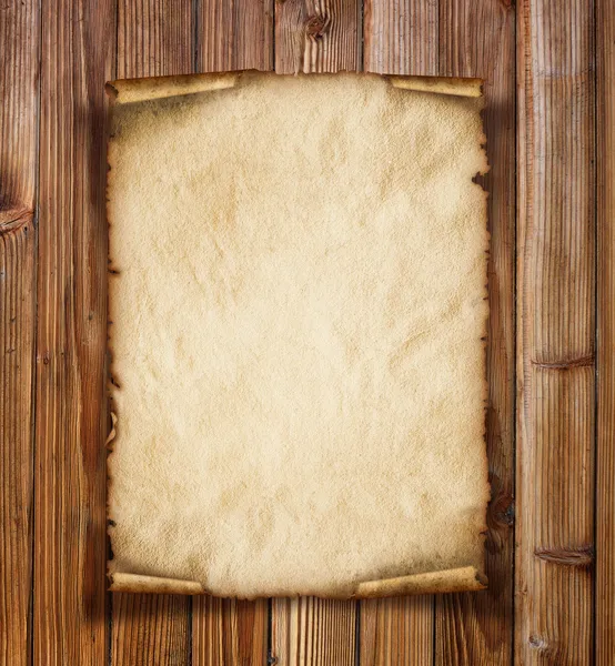 Old paper on the wood background — Stock Photo, Image