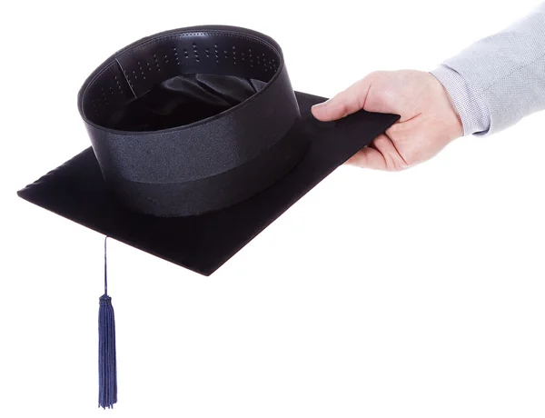 Mortarboard academic graduation cap in the hand — Stock Photo, Image