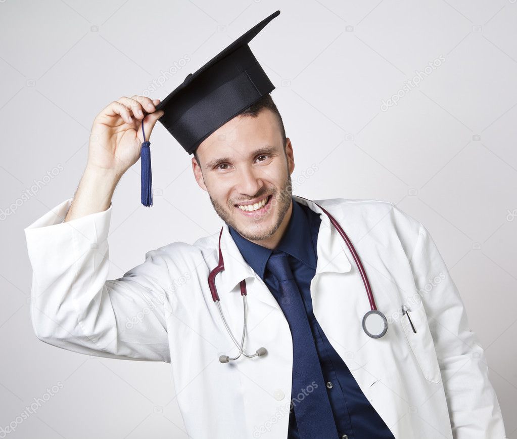 young doctor smiling with mortarboard