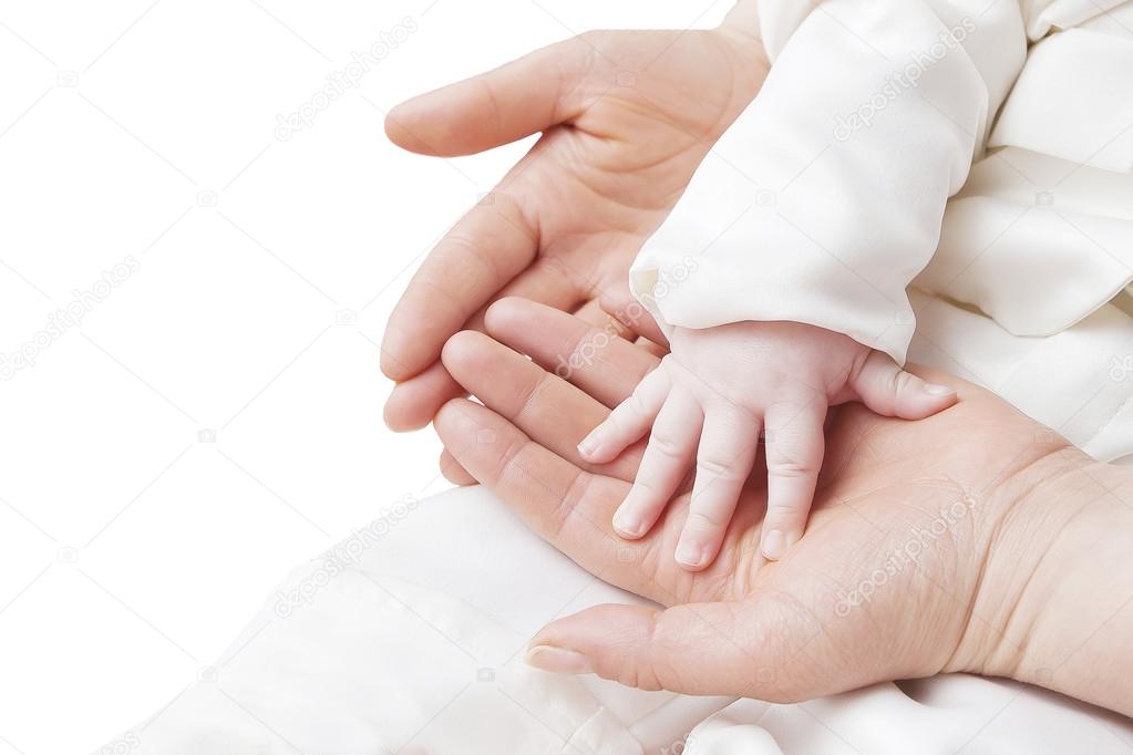 hand of a child in mother's hands