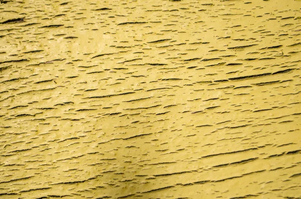 Tinta amarela sobre madeira — Fotografia de Stock