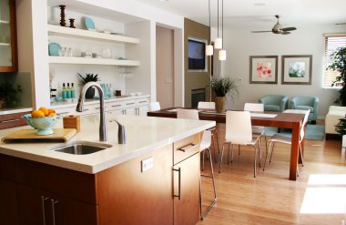 Modern kitchen with sitting and dining area clipart