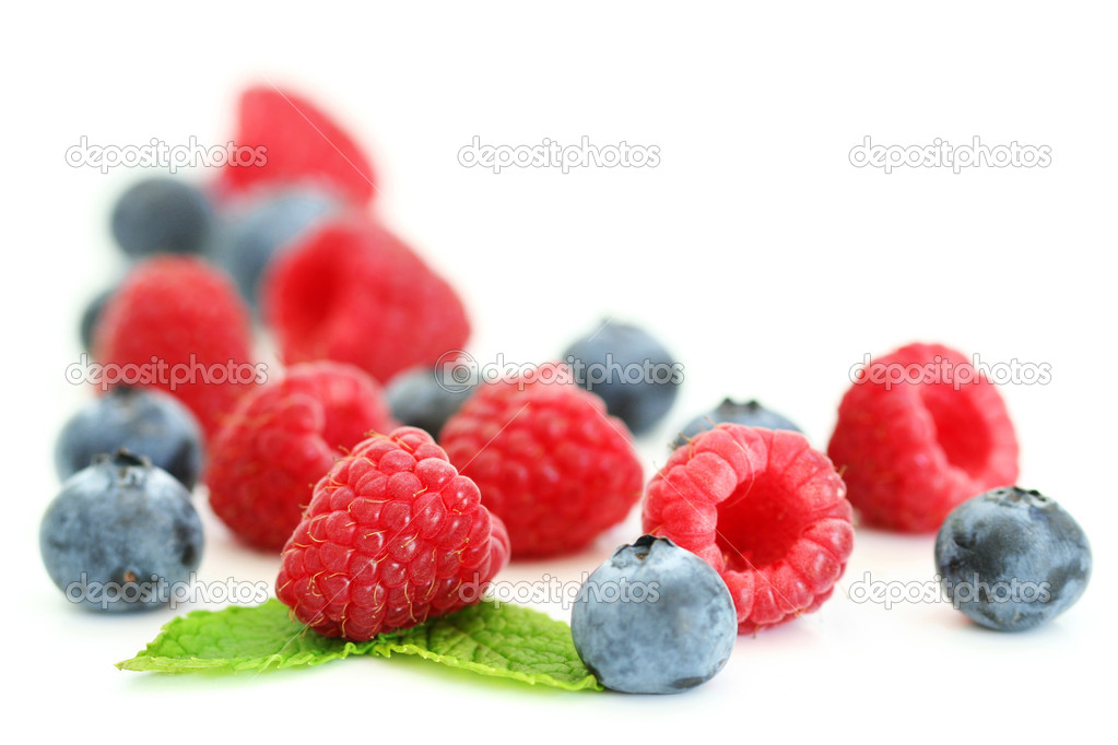 Bluberries and raspberries on white