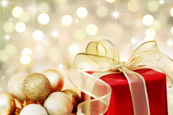 Christmas gift on defocused lights background — Stock Photo, Image