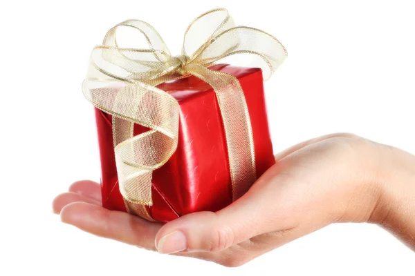 Red gift box in woman's hand Royalty Free Stock Photos