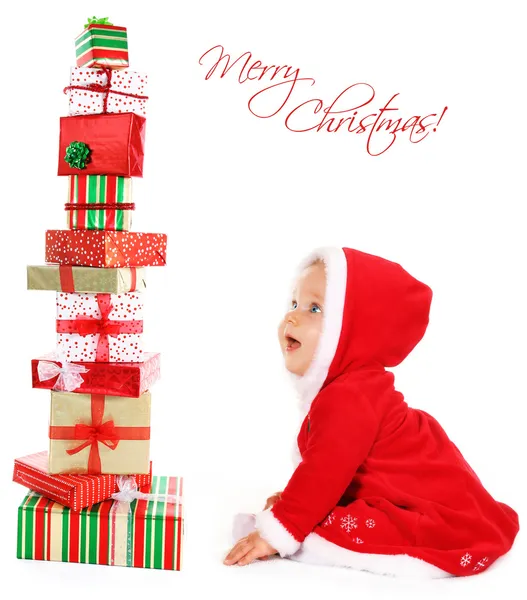 Weihnachtsbaby mit Geschenken — Stockfoto