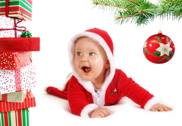 Christmas baby unders a tree with gifts — Stock Photo, Image