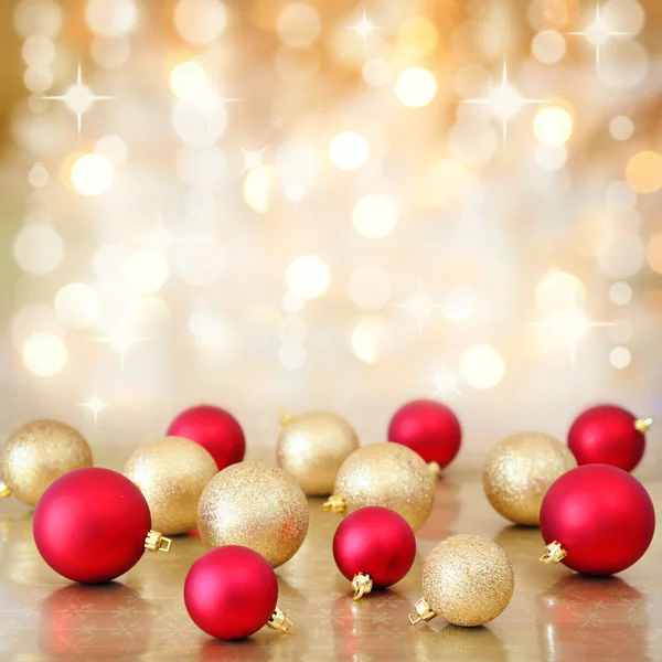 Christmas baubles on defocused lights background — Stock Photo, Image