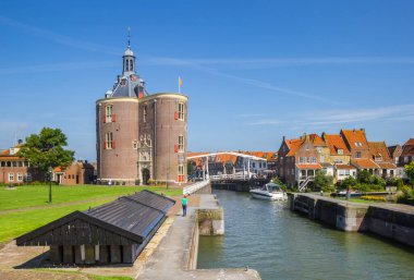 Historic city gate and lock in the old harbor of Enkhuizen, Netherlands clipart