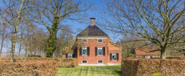 Panorama of a historic farm house in Groningen, Netherlands clipart