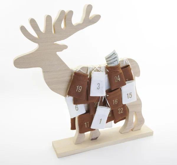Reindeer Christmas calendar with dollars — Stock Photo, Image