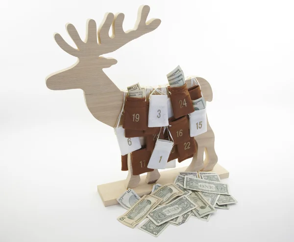 Calendario de Navidad de renos con dólares — Foto de Stock
