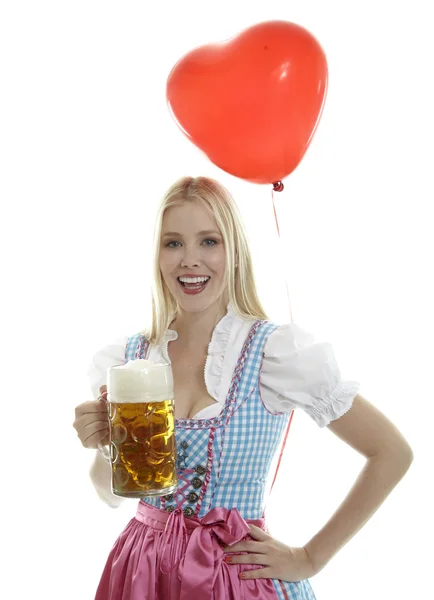 Женщина в Дирндле с воздушным шаром — стоковое фото