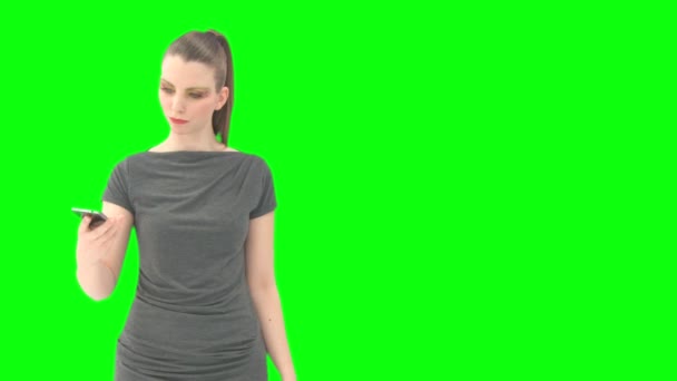 Woman with greenscreen and alpha matte — Wideo stockowe