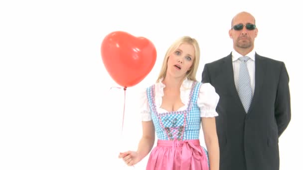 Woman in Dirndl with Bodyguard — Stock Video