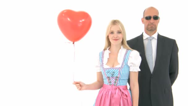 Woman in Dirndl with Bodyguard — Stock Video