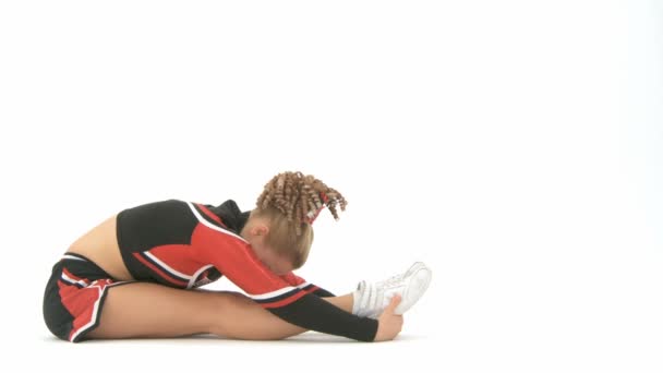 Cheerleader strekt zich uit — Stockvideo