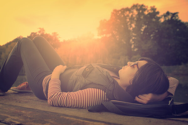 Vintage photo of relaxing woman on a pier