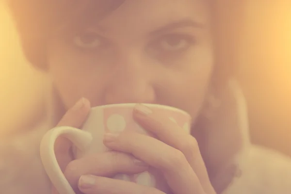 Vintage photo of tired woman drinking morning coffee or tea — Stock Photo, Image