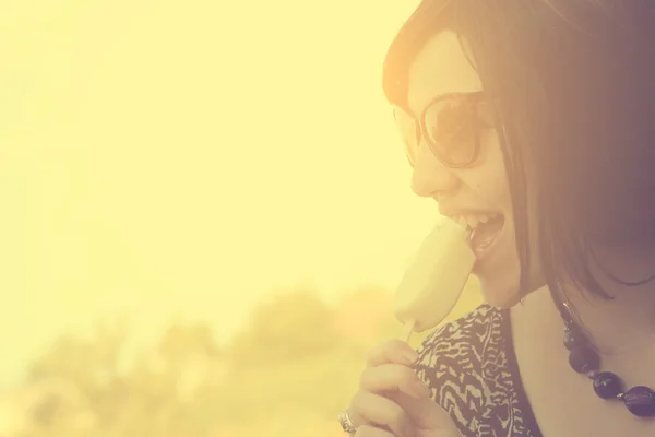 Vintage photo of young woman with ice cream — Stock Photo, Image