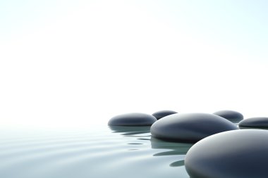 Zen stones in water on white background
