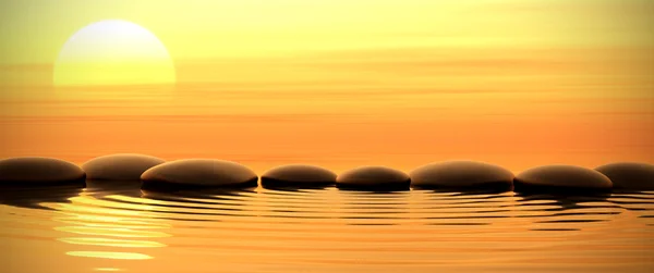 Pietre zen in acqua al tramonto — Foto Stock