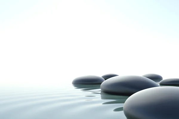 Piedras Zen en agua sobre fondo blanco — Foto de Stock