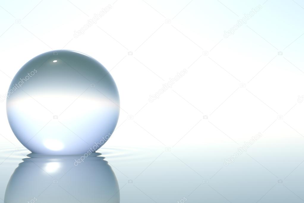 Zen glass sphere in water on white background