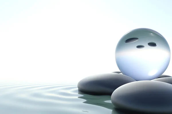 Zen taşlar ve beyaz zemin üzerine Cam Küre