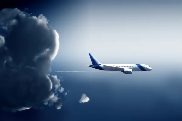 Airplane flies away from a cloud — Stock Photo, Image