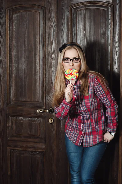 Beautiful girl in plaid shirt and glasses — Stock Photo, Image