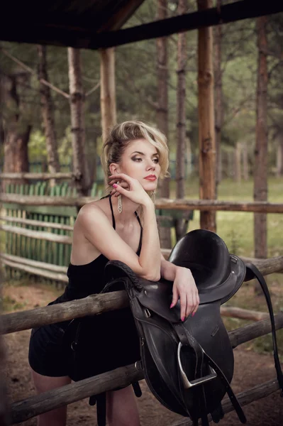 Glamour blonde girl in the stable — Stock Photo, Image