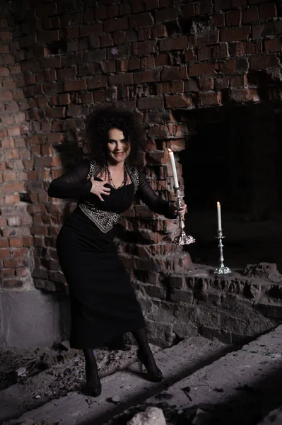 Young sexy witch making the witchcraft in the dungeon — Stock Photo, Image