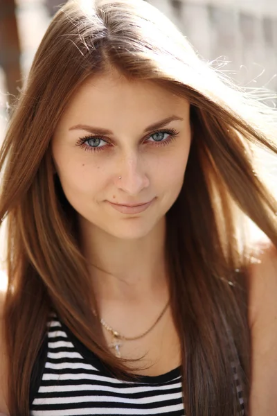 A girl in a striped T-shirt — Stock Photo, Image